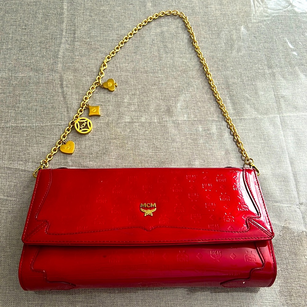 - Red and patent leather MCM handbag with gold hardware . Stunning